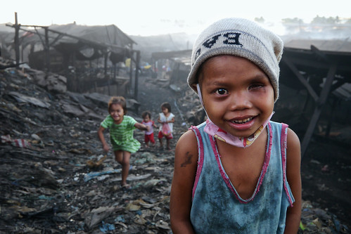 Charcoal Factory, Tondo - A partial blind charcoal girl